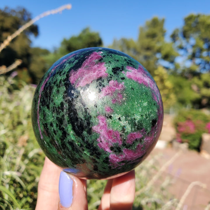 Olivenorma Natural Ruby Zoisite Crystal Sphere - 1000g - image 0