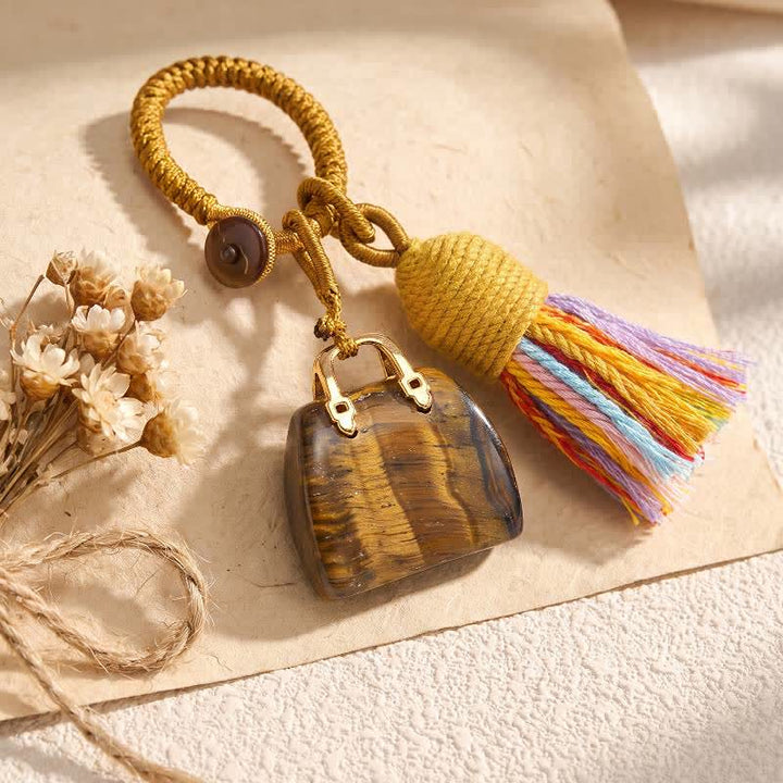 Olivenorma Natural Crystal Handbag‑Shaped Tassel Braided Prosperity Blessing Keychain - Tiger Eye - image 1