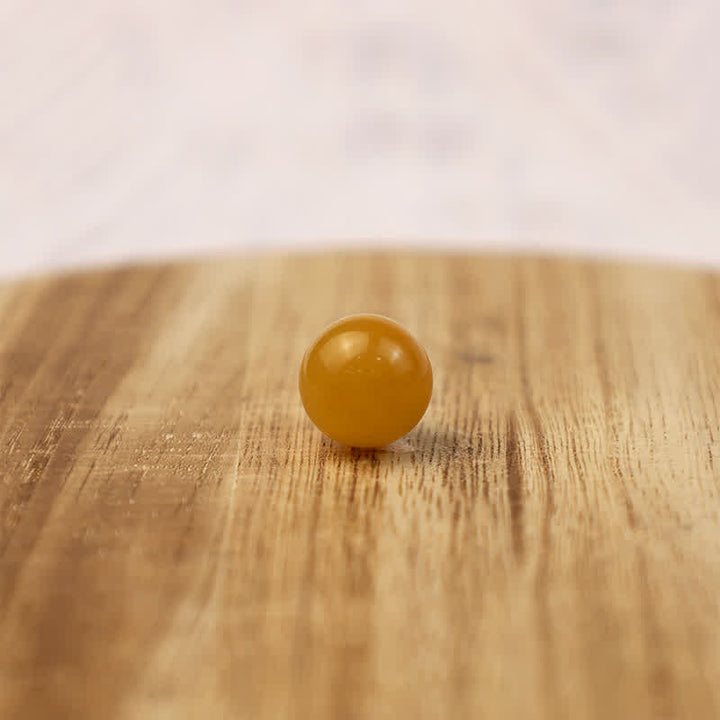 Olivenorma Yellow Jade Positive Crystal Sphere - image 3