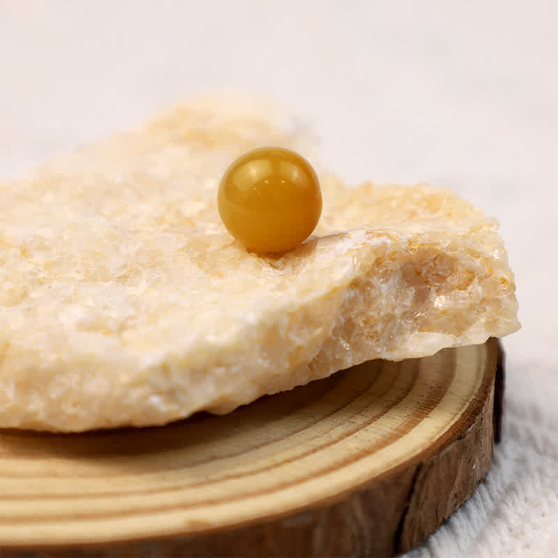 Olivenorma Yellow Jade Positive Crystal Sphere - image 1