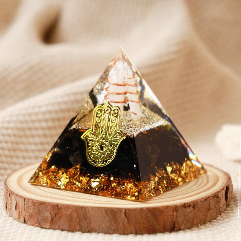 Olivenorma Clear Crystal With Obsidian Hamsa Orgone Pyramid - image 1